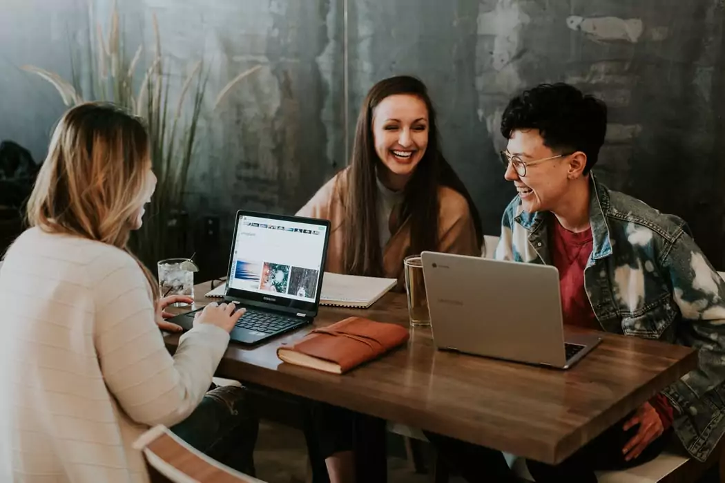 Happy employees in an organization that performs a cultural analysis